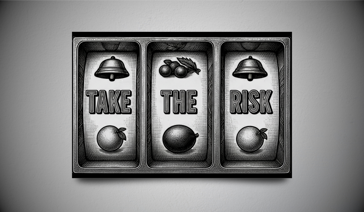 A rectangular black and white framed wall art print mounted on a gray wall. The artwork is divided into three horizontal panels with embossed-style imagery: a bell, the word 'TAKE', an apple, cherries, an olive, the word 'THE', and a bell and apple with the word 'RISK'.